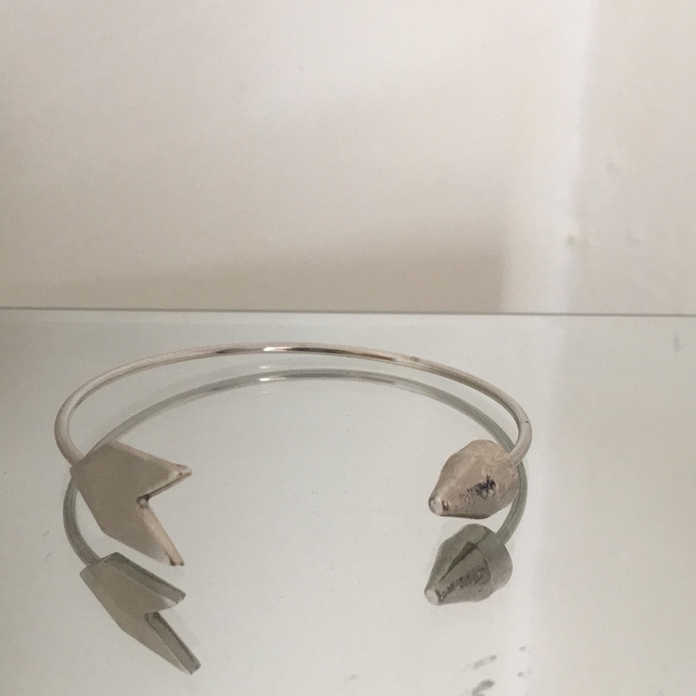 Silver colored arrow bangle bracelet